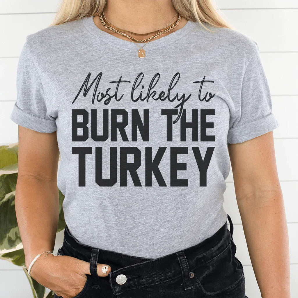 Most Likely To Burn The Turkey Thanksgiving Tee product image 1