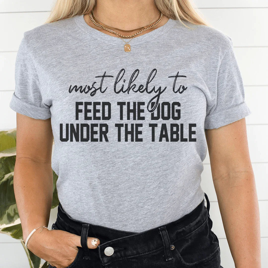 Most Likely To Feed The Dog Under Table Thanksgiving Tee product image 1